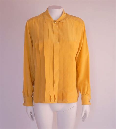 cute yellow blouse that chanel jones is wearing today